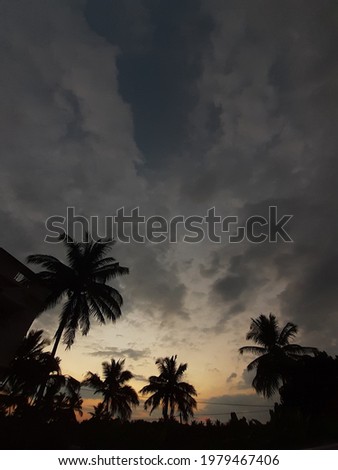 An Image Captured during sun rays in a very  cloudy atmosphere 
dark mode photo 