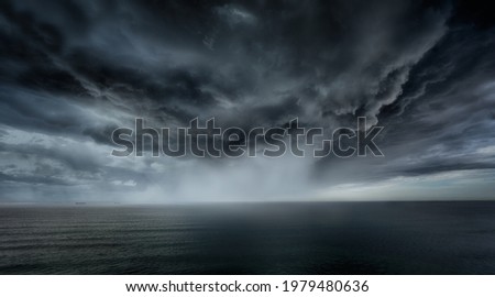 stormy clouds and rain with dramatic sky Royalty-Free Stock Photo #1979480636