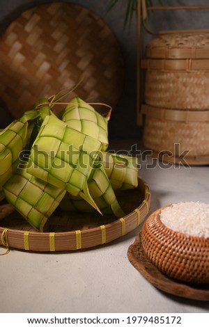 Ketupat, a natural rice casing made from young coconut leaves for cooking rice. Usually served on Raya or other religion celebration in Indonesia. Selective focus.