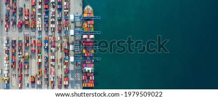 Aerial view container ship in port at container terminal port, Ship of container ship stand in terminal port on loading, unloading container, Commercial cargo ship in sea port. Royalty-Free Stock Photo #1979509022