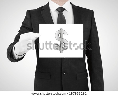 businessman in suit holding placard with dollar symbol