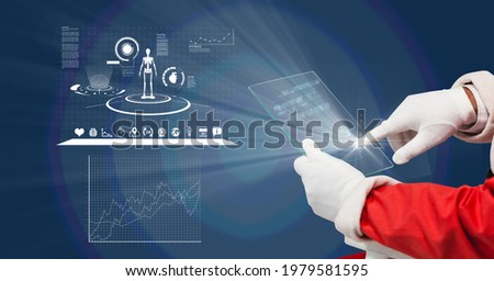 Composition of santa claus holding interactive screen with medical data processing. global online medicine and technology concept digitally generated image.