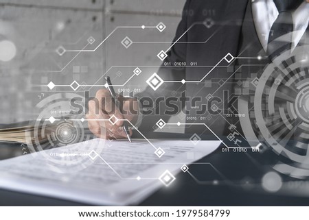 Businessman in suit signs contract. Double exposure with technology illustration hologram. New partnership in it business concept.