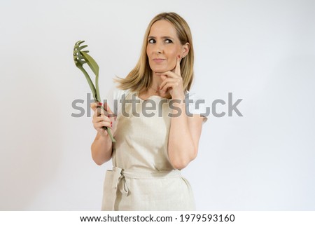 Beautiful woman holding kitchen utensils,food and lifestyle concepts.
