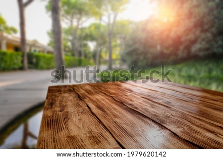 Wooden table at an exotic campsite on a beautiful hot day 