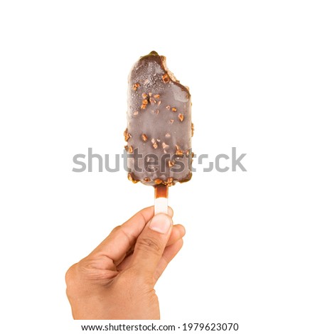 woman hand holding a Bite taken Peanuts chocolate ice cream wooden stick isolated white background