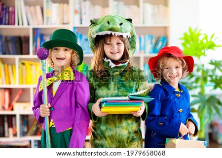 Kids in book character costume. School dress up party. English language and literature study for young children. Reading for primary school kid. Library event. Fun learning. Royalty-Free Stock Photo #1979658068
