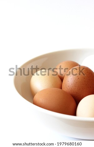 Fresh Hen's Eggs Isolated on White Background with Copy Space. Easter Celebration Concept.