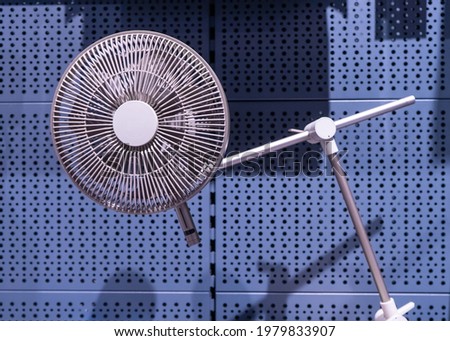 stylish desktop fan in bronze color with three-point bending capability.