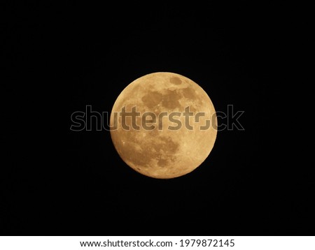 Full moon against the black sky