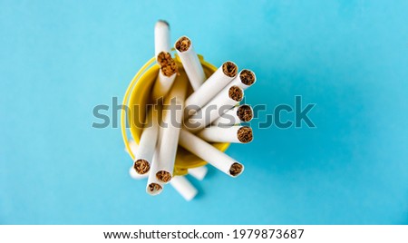 cigarettes in trash can, quit smoking - 31 may World No Tobacco Day infocard	
