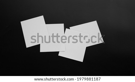 Blank Mock-up paper. brochure magazine isolated on black table, changeable background , white paper isolated on dark tone.