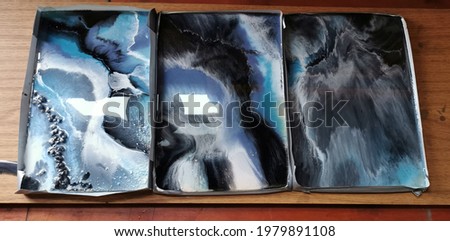 Epoxy resin poured pictures. Abstract white, black and blue modules. Marble effect, fluid art acrylic flowing colours. Resin art workshop in carpentry masterpiece