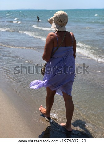 Woman with straw hat enjoying Adriatic sea side , Durres, Albania. Summer holidays concept.
