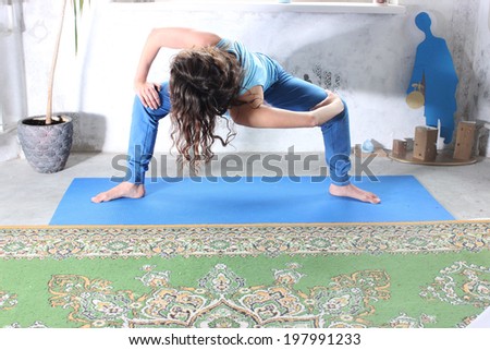 Yoga practice or Yoga at home, a Beautiful young woman doing yoga