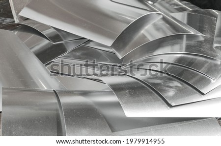 piles of industrial aluminum metal. small pieces of waste of left over production Royalty-Free Stock Photo #1979914955
