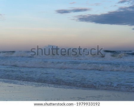 pastel colored sky at dusk on a picturesque sandy beach