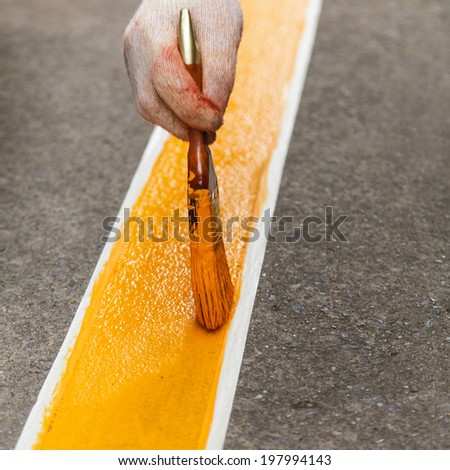 Painting yellow line on the floor