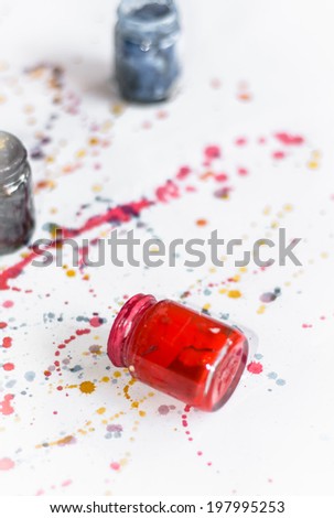 Colorful water color splash with color bottle on paper background