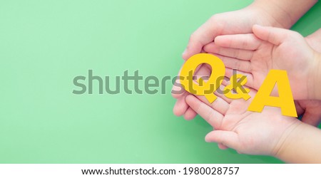 kid family hands with sign question mark and Answer symbol on hands.FAQ( frequency asked questions), Answer, QA, Information, Communication, People and vaccine, covid19, school information, Kid child.