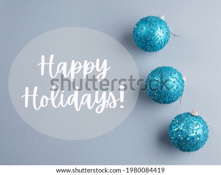 Christmas new year minimal gray greeting card with blue disco ball ornament wishing Happy holidays