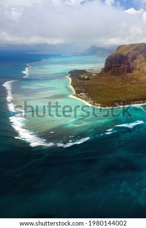 A bird's-eye view of Le Morne Brabant, a UNESCO world heritage site.Coral reef of the island of Mauritius.Storm cloud.