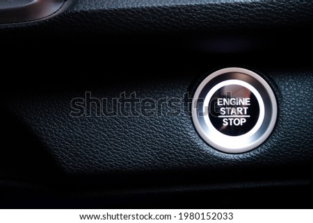 Push engine start and stop Button on car. New technology of car. Engine start concept.