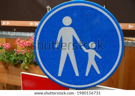 Pedestrian road sign in the city.