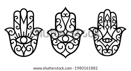 Set of decorative hamsa symbols with eye. Elements of patterns for laser and plotter cutting, embossing, engraving, printing on clothing. Ornaments for henna drawings in the oriental style. Royalty-Free Stock Photo #1980161882