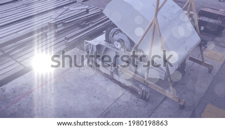 Composition of saw and metal bars in industrial site with spots of light. industry and production concept digitally generated image.