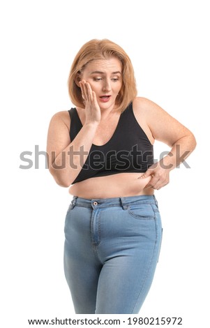 Troubled overweight woman on white background. Weight loss concept