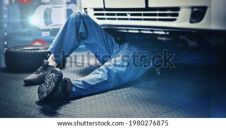 Composition of interactive screen with digital car drawing over car mechanic lying under car. car mechanic garage and technology concept digitally generated image