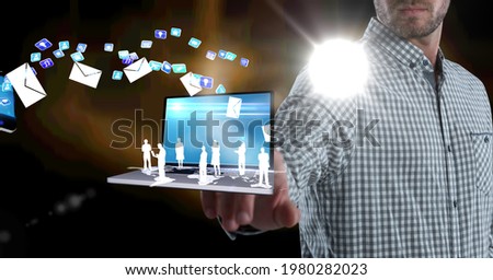 Composition of businessman using interactive screen with laptop, cloud and digital icons. global networking, business and technology concept digitally generated image.
