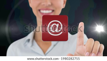 Composition of smiling businesswoman touching screen with digital email icon. business, technology, digital interface and communication concept digitally generated image.
