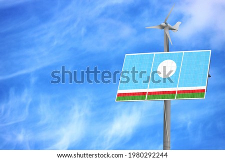 Solar panels against a blue sky with a picture of the flag of Sakha Republic