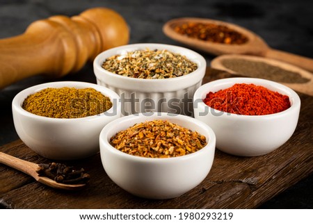 Variety of spices and seasonings on the table. Royalty-Free Stock Photo #1980293219
