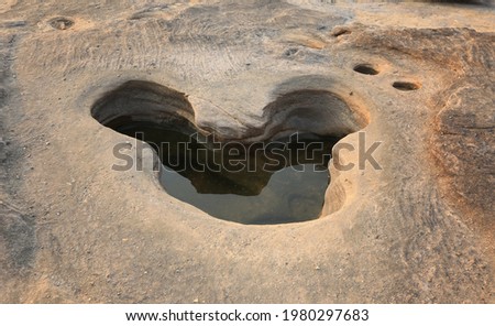 The amazing natural rock hole-shaped look like the mouse. Natural of Rock Canyon in Khong River after the water comes down in Summer, Sam Phan Bok, Ubonratchathanee Province, North East of Thailand