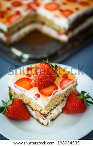 honey cake with strawberry and red currant