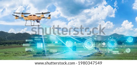 5G technology trend and smart farm agriculture concept.Farmer use ai drone to monitor prediction forecast check of plant field.Agriculture drone fly for research analysis,terrain scanning. Royalty-Free Stock Photo #1980347549
