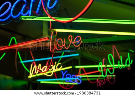 Different neon signs with words