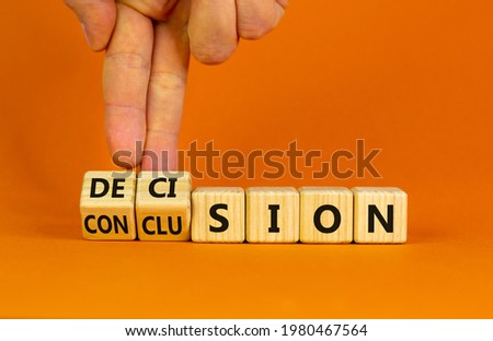 Decision or conclusion symbol. Businessman turns wooden cubes and changes the word 'conclusion' to 'decision'. Beautiful orange background. Business, decision or conclusion concept. Copy space.