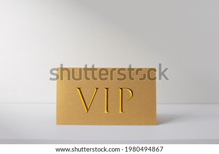 Golden VIP card on white desk, ID card for VIP persons, business concept picture