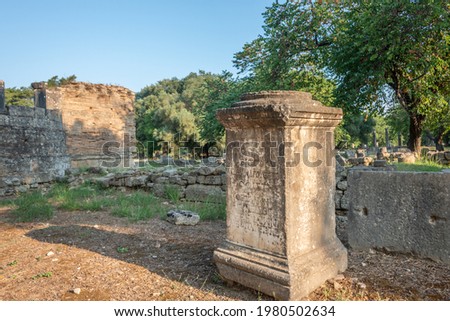 Broken Column remains in the Old city of Olympia in Peloponnes with its ancient monuments, Greece