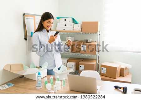 Taking pictures for the online shop and business social media. Young woman posting her new beauty products for her e-commerce 