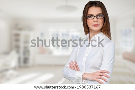 Successful millennial lady stand at home keep arms crossed Royalty-Free Stock Photo #1980537167