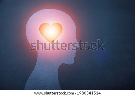 Shining Heart image in the human head. Love, instinct, and romance concept. Royalty-Free Stock Photo #1980541514