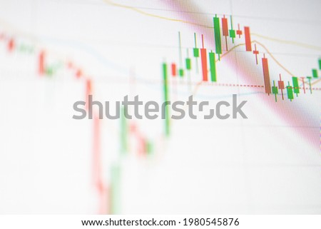 Close up Green and red Candle graph on digital screen. Concept for financial and stock graph.