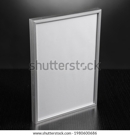 Image made in studio of an empty aluminum photo frame. Graphic resource.