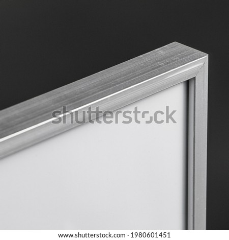 Detail image made in the studio of an empty aluminum photo frame. Graphic resource.