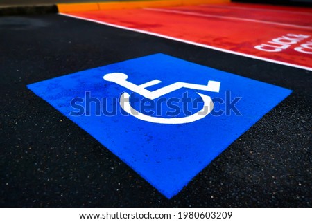 Disability wheelchair parking reserved space in public car park, Australia.